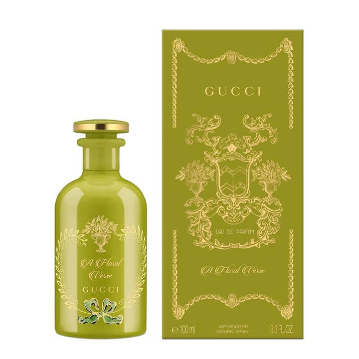 Gucci perfume bottle and packaging with floral design on a white background