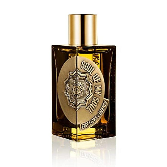 Perfume bottle with gold cap and label on a white background