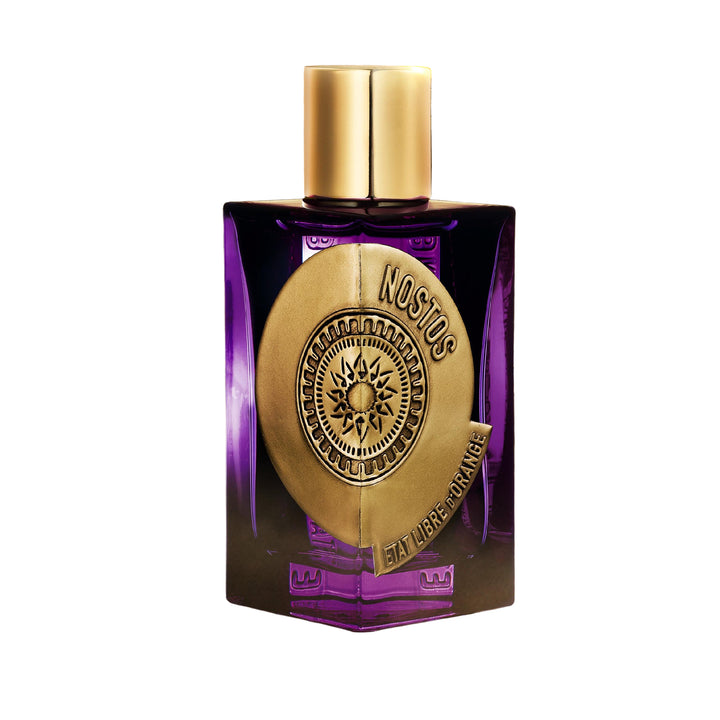 Purple and gold perfume bottle with 'Nostos' branding on a decorative background