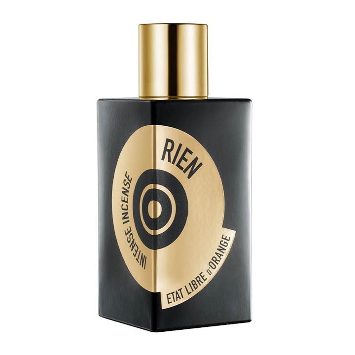 Perfume bottle with gold cap and black and gold label on a white background