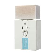 White perfume bottle with a blue label on a white background