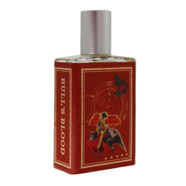 Perfume bottle with red label featuring a bull and text on a white background