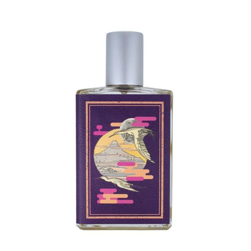 Perfume bottle with a decorative label on a white background
