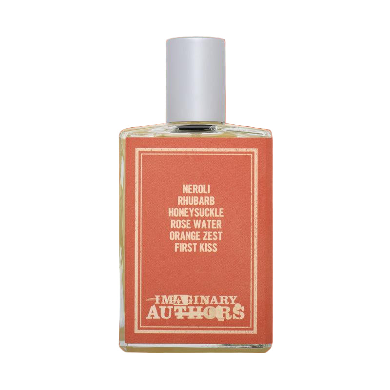 Perfume bottle with red label on an orange background