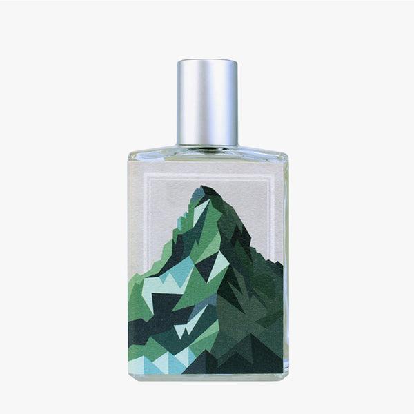 Perfume bottle with mountain design on a white background