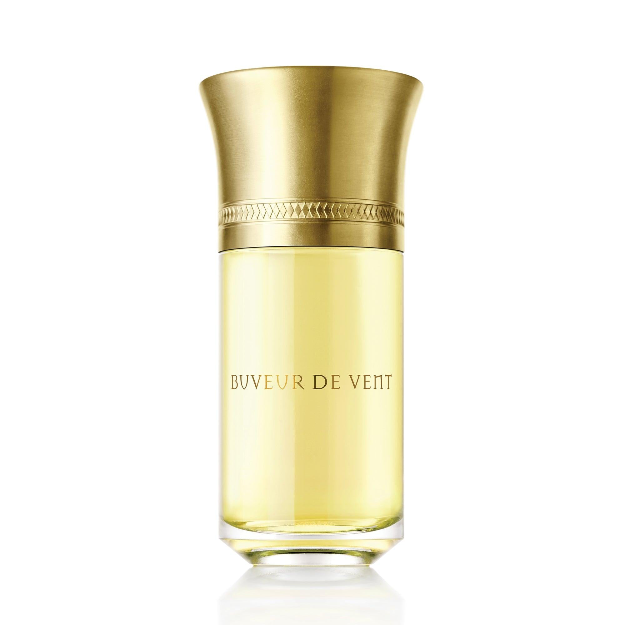 Gold and clear perfume bottle labeled 'Buveur de Veit' on a white background