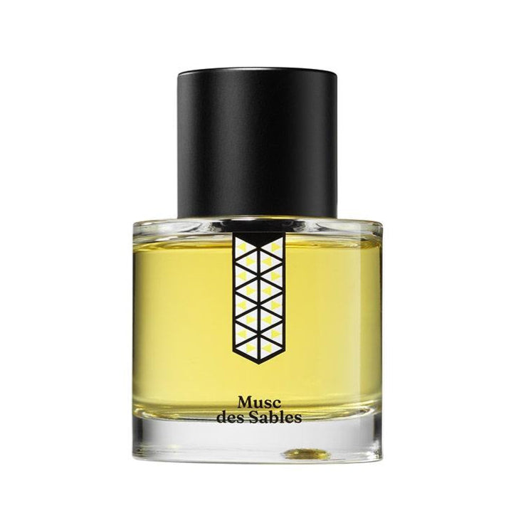 Perfume bottle labeled 'Musee des Sables' with a black cap on a white background