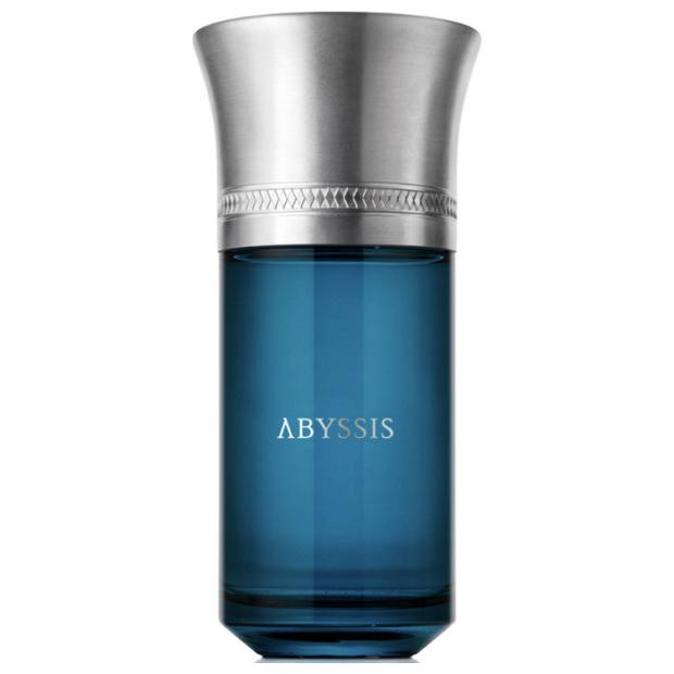 Blue perfume bottle with silver cap on a white background