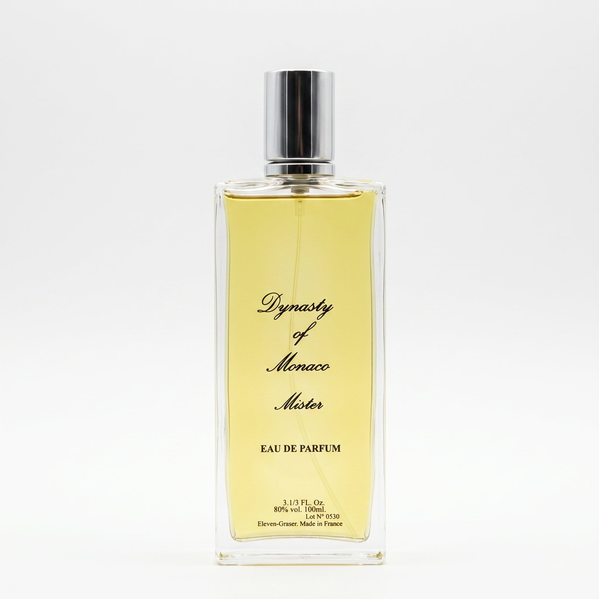 A rectangular glass perfume bottle filled with pale yellow liquid, featuring a silver cap and black cursive text reading 'Dynasty of Monaco Motor' and 'EAU DE PARFUM'.