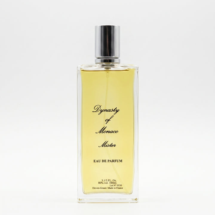A rectangular glass perfume bottle filled with pale yellow liquid, featuring a silver cap and black cursive text reading 'Dynasty of Monaco Motor' and 'EAU DE PARFUM'.